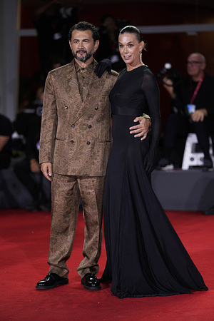 Milena Mancini and Vinicio Marchioni from "L'Isola Di Andrea" (Andrea's Island) attend the "Piero Pelù. Rumore Dentro (Noise Inside. Don't Call Me A Rock Star)" red carpet during the 82nd Venice International Film Festival.