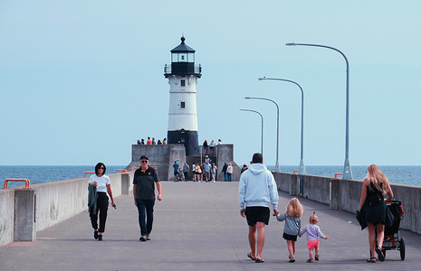 People visit the Duluth Harbor North Pier Lighthouse in Duluth.