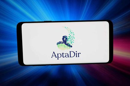 In this photo illustration, the logo of Italian biotech company Aptadir Therapeutics is seen displayed on a smartphone in front of abstract background on computer screen.