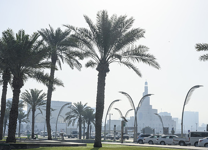 The Fanar Islamic Cultural Center seen through heavy fog.