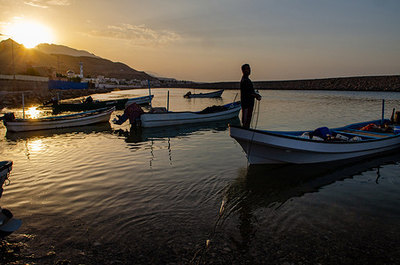 Omani fishermen casting their nets at Tiwi village harbor, Oman.
Often overlooked as a potential travel destination and yet its rich history and centuries old culture that has so much to offer. Oman is an incredibly diverse landscape of tropical palm fringed wades, remote deserts and green terraced mountains, thriving Souks and one of the most welcoming people of the Arabian Gulf region and must deserve further attention.