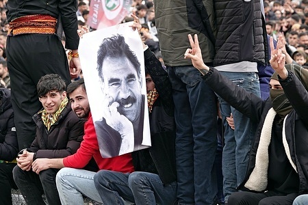 A poster of PKK leader Abdullah Ocalan is seen being carried at the Newroz celebration in Diyarbakir. At the Newroz celebration, which was celebrated on March 21 in the city of Diyarbakir in Turkey and attended by hundreds of thousands of people, a large number of demonstrators carried posters of Abdullah Ocalan, the leader of the Kurdish armed organization Kurdistan Workers' Party (PKK). Abdullah Ocalan, who has been held in prison for 25 years, had asked the PKK, an organization that has been in conflict with the Turkish army for 40 years, to lay down its weapons and dissolve itself. The peace negotiations between the PKK and the Turkish state are continuing.