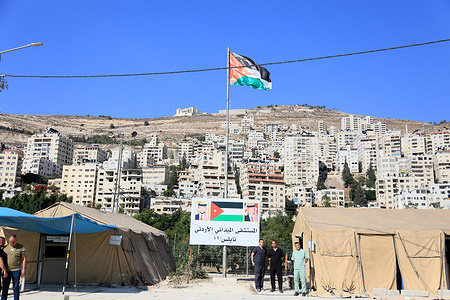 Jordanian flag seen flying during the visit of Palestinian Prime Minister Dr. Mohammad Mustafa ( not in view) to the West Bank city of Nablus. During his visit, he inspected the Jordanian field hospital and met with the Jordanian medical staff in Nablus.