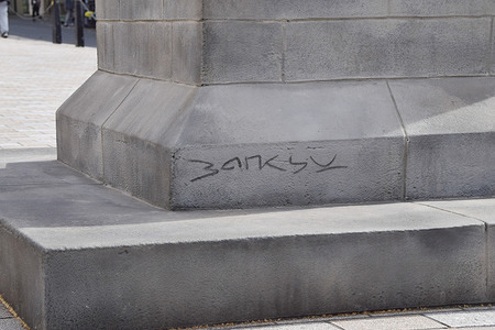A mysterious statue depicting a man holding a flag which obscures his face, and signed 'Banksy' at the base of the plinth, has appeared in Waterloo Place in Central London. It has not yet been officially confirmed if the street artist Banksy is behind this latest artwork.