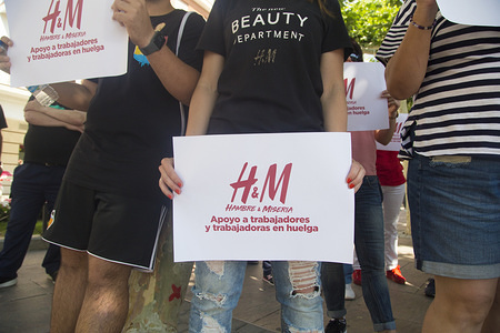 Protesters display placards in support of the H&M workers.
Workers of the H&M logistic center in Madrid has gone on strike and took to the street of Madrid to demand higher wages and shorter working hours.