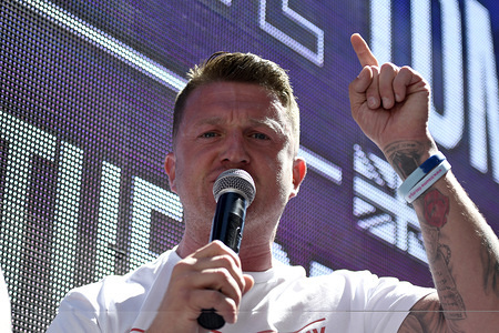 Tommy Robinson -real name is Stephen Yaxley-Lennon seen at the Old Bayley in London addressing his supporters.

The right-wing leader Tommy Robinson, whose real name is Stephen Yaxley-Lennon, attended The High Court for latest contempt hearing. Pro Tommy Robinson demonstrators gathered outside the Old Bailey, while Yaxley-Lennon, (aka) Robinson spoke.