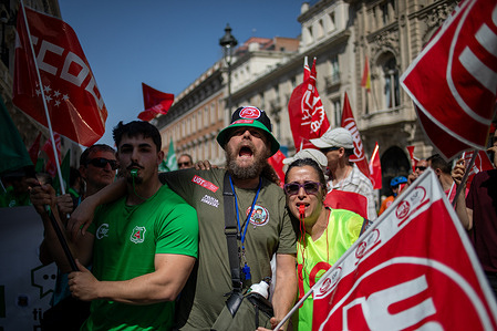 Demonstrators hold flags during the forest firefighter protest. A rally was held by forest firefighters in front of the Ministry of the Presidency, Justice and Interior to demand better working conditions including a fair collective bargaining agreement and job security.