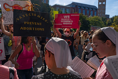 Rally participants confront and antagonize Members of Ephrata Ministries church as people gather for "Rally For Abortion Justice" in Washington Square Park in New York City. 
Supporters of reproductive choice and abortion rights activists take part at more than 600 marches across the US in support of reproductive rights as the most restrictive anti-abortion bill yet went into effect in Texas last month.