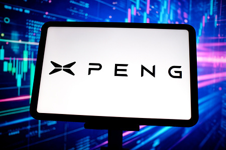 In this photo illustration, the XPeng logo is seen displayed on the screen of a tablet.