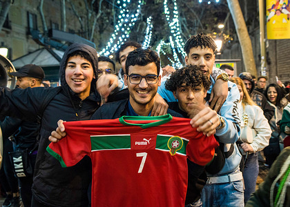 Football supporters display a Morocco puma jersey 7 to celebrate the victory of Morocco over Portugal in 2022 FIFA World Cup at Las Ramblas. The Moroccan national soccer team made history by qualifying for the semifinals of the World Cup in Qatar after defeating Portugal 1-0. Supporters celebrated in Barcelona, where theMoroccan community is one of the most numerous.