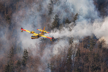A Croatian Canadair CL-415 firefighting plane drops water on a wildfire near Preddvor, after it was called in to help Slovenian firefighters. The cause of one of the largest wildfires in Slovenia is not known, but prolonged drought in the country is helping it spread and continue unabated. A large wildfire broke out in the hills above Preddvor, Slovenia, on March 28 and kept raging and spreading. The fire rages on because of the severe drought in the country. Since Slovenia does not have a firefighting aircraft, neighbouring Croatia sent a Canadair firefighting airplane to help the Slovenian firefighters.
