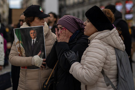 A protester (C) cries while others comfort her during the demonstration. Iranians residing in Spain demonstrated in Madrid's Puerta del Sol square to demand an end to the violence and repression by the Islamic Republic regime during the protests in Iran.