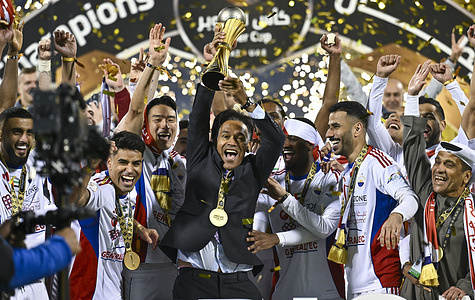 Sharjah players celebrate with the trophy on the podium after winning the Super Cup QatarÐUAE match between Al-Gharafa and Sharjah at Thani Bin Jassim Stadium. Final score; .Sharjah won the penalty shoot-out 5-4 after the game finished 1-1.