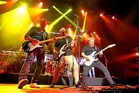 (L to R) Daniel Mezquita ,David Summers and Rafael Gutierrez members of the band Hombres G seen during the Hombres G performance at Jardins de Terramar Sitges in Barcelona. The pop-rock band " Hombres G" performs in Sitges before 2000 people at the Jardins de Terramar Festival. Hombres G is a Spanish pop rock band founded in Madrid in 1982 by its vocalist and bassist David Summers. In the 1980s, it became popular in Spain and was one of the pioneering groups and also triumphed in Latin America.