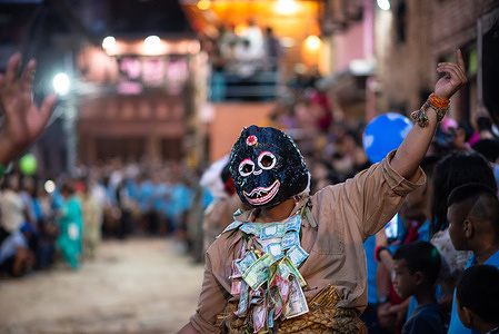 A man dressed in a traditional costume performs a holy dance during the festival. People celebrate Gai Jatra or cow festival in memory of the departed souls in the past year for salvation and peace. It is believed that cows guide the departed souls to cross the river to get to heaven.