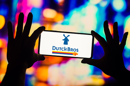 In this photo illustration, the Dutch Bros. Coffee logo is displayed on a smartphone screen.