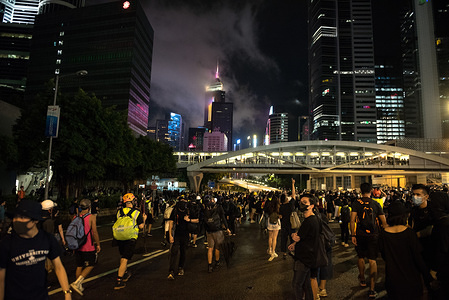 Protesters walk along the highway as they take part during a peaceful demonstration.
Protesters defied police orders and marched from Causeway Bay all the way to Sheung Wan. Despite heavy rain, over a million participants peacefully marched in support of the anti-extradition movement. Organisers estimate 1.7 million people participated in the rally while police put the figure at under 500,000.