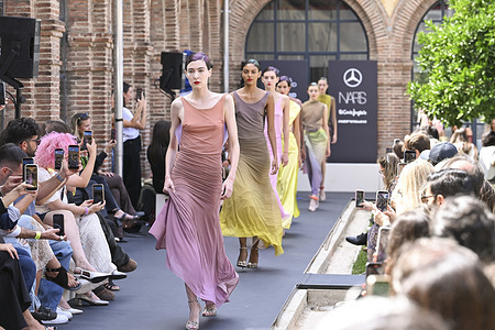 A model parades with Ernesto Naranjo design during the Mercedes Benz Fashion Week Madrid at Cibeles Palace in Madrid.