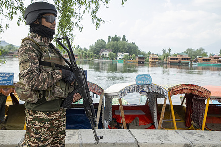 Indian Paramilitary soldier stands alert in Srinagar, the summer capital of Jammu and Kashmir. According to media reports, officials confirmed that multiple explosions were heard near Srinagar International Airport, which is located next to an Army airfield.