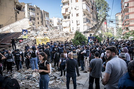Journalists on a Hezbollah-led media tour in Dahiyeh, southern Beirut, to see damage following almost two weeks of air strikes in the area by the Israeli military. Israel has launched a series of deadly assaults on Lebanon, saying that they are targeting Hezbollah fighters and facilities with the goal of returning their evacuated citizens to northern Israel.