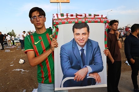 An Amedspor fan carrying a poster of the prominent Kurdish politician Selahattin Demirtas, who has been imprisoned in Turkey for nine years, is seen during the celebrations. Kurdish team Amedspor moved to the top of the Turkish Super League standings in the sixth week of the season after defeating Beşiktaş 3–2 at home in Diyarbakır. The victory lifted Amedspor above Galatasaray and Beşiktaş in the standings, sparking hours of celebrations among fans across Diyarbakır.