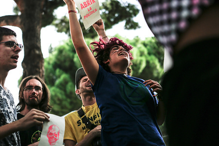 A climate activist shouting while jumping during the demonstration.Hundreds of climate activist from Extinction Rebellion movement protest, the activists paralyzed the main street in the city and then camped in front of Spain's Ministry of environmental and climate issues for five days.