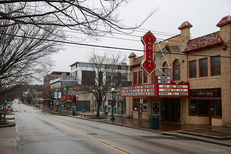 BLOOMINGTON, UNITED STATES - MARCH 18, 2020: A quote attributed to Mr. Rogers fills the marquee above the Indiana Theater in deserted downtown where parking it normally very difficult to find during the Covid-19/Coronavirus emergency in Bloomington. When I was a boy and I would see scary things in the news, my mother would say to me, "Look for the helpers. You will always find people who are helping," Fred Rogers.