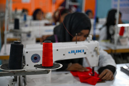 Khadiza Akhtar Tonni (16), a school dropout, is learning sewing machine operation at a training center. Bangladeshi school dropout adolescent girls are gaining confidence by learning a range of skills, from operating sewing machines to acquiring basic technology education, paving the way for employment opportunities. Many hope to secure jobs in the garment sector after completing the sewing training, while others aim to find work or freelance opportunities following their computer training, helping them support themselves and their families.