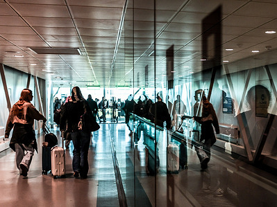Passengers walk along the corridors of Stansted Airport as the industry reassures that it will have enough fuel for the summer season despite chaos caused by the blockage of Hormuz Strain.