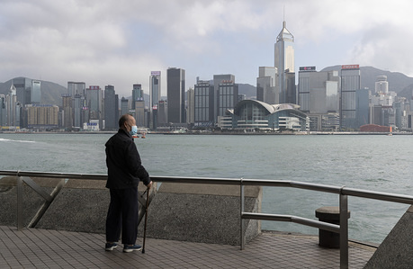 A masked man looking out Victoria Harbour in the very quiet and empty Tsim Sha Tsui Promenade - one of the the top 10 Hong Kong attraction and normally full of tourist.
The deadly coronavirus (known as COVID-19) has caused most industries, factories and malls in China shut down. More than 50 million people are in quarantine.