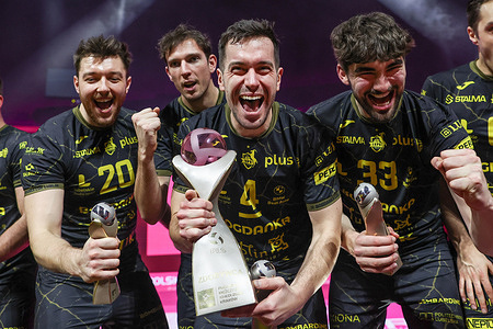 Maciej Zajac (L), Marcin Komenda (C) and Fynnian McCarthy of Bogdanka Luk Lublin (R) celebrate with the trophy during the Polish Cup match between Bogdanka Luk Lublin and Asseco Resovia at Tauron Arena Krakow. Final score Bogdanka Luk Lublin 3 : 0 (25:15, 25:20, 23:20) Asseco Resovia.