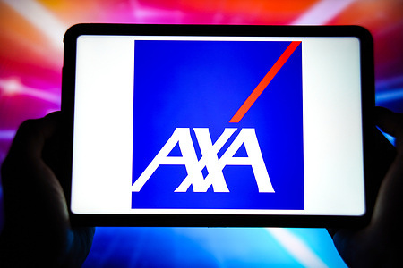 In this photo illustration, the AXA logo is displayed on the screen of a smart tablet.
