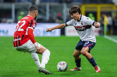 (L-R) Benjamin Dominguez of Bologna FC seen in action with Kyle Andrew Walker of AC Milan during Serie A 2024/25 football match between AC Milan and Bologna FC at San Siro Stadium. Final Score Milan 3 : 1 Bologna