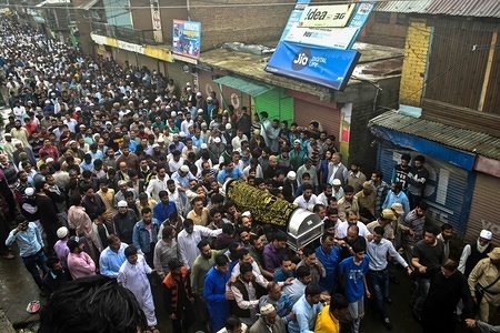 Kashmiri mourners carry the coffin of Shujaat Bukhari, veteran journalist and Editor-in-Chief of English daily 'Rising Kashmir,' in Kreeri, some 45kms from Srinagar, Indian administered Kashmir. Thousands of mourners attended Shujaat Bukhari's funeral in Baramulla today. Bukhari and his personal security officers (PSO's) were shot dead by unidentified gunmen at Press Colony in Srinagar on Thursday evening.