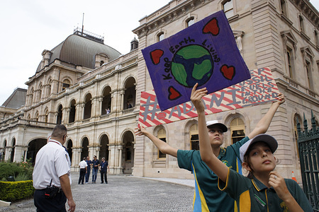 Students seen holding placards at Queensland Parliament House during the protest.
School and university students, teachers, parents and other protesters marched from Queen's Gardens to Queensland Parliament House taking part in the School Strike 4 Climate protest and March. They call for government action on climate change policy. Australia.