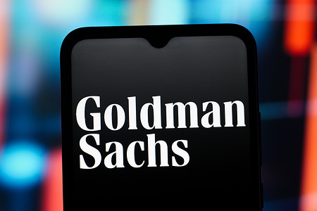 In this photo illustration, the Goldman Sachs (GS) logo is seen displayed on a smartphone screen.