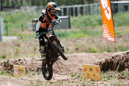 A competitor seen avoiding an obstacle during the third round of Surron's E-POWER CROSS in Chongli, Hebei. Surron's E-POWER CROSS, an electric dirt bike racing series, is a highly competitive event that drew top off-road riders and motocross enthusiasts to the former Winter Olympic hub, showcasing intense dirt track maneuvering that highlighted the high-torque performance of modern zero-emission electric motorcycles. The event attracted over 200 participants competing in five categories: Gold, Silver, Bronze, Women's, and HyperBee.