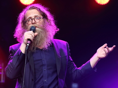 Canadian folk singer Ben Caplan from Halifax, Nova Scotia. performs on Day One of the World renowned Cambridge Folk Festival at Cherry Hinton Hall, Cambridge.