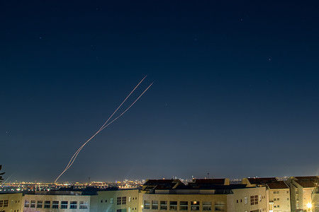 An Israeli Air defense system intercepts a ballistic missile barrage launched from Iran to central Israel during the missile attack.