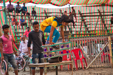 Bangladesh has a very long history of traditional circus. Now a days few large circus troops are performing around the country. Most of the troop members took his profession hereditary or are working from childhood. Major events of the performances are mostly balance on rope, cycling, jump from top, walk the tightrope etc. Some shows animal games also. People of our environs enjoy circus once a year. In recent decades, this tradition has slashed down due to the invasion of globalization.