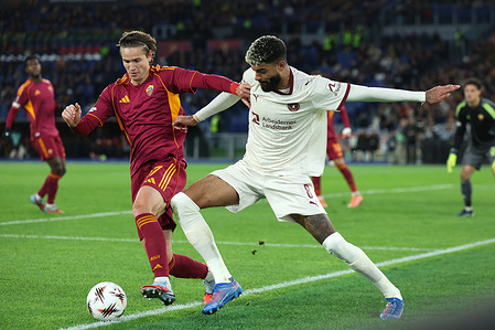 (L) Daniele Ghilardi of Roma, (R) Philip Billing of Midtjylland seen in action during the UEFA Europa League 2025/2026 football match day 5 between AS Roma Vs FC Midtjylland at Olympic stadium. Final score Roma 2 : 1 Midtjylland
