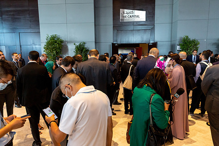 Participants wait in the foyer to enter the plenary hall where the high level climate summit opens on the second day of the COP27 UN Climate Change Conference, held by UNFCCC in Sharm El-Sheikh International Convention Center. COP27, running from November 6 to November 18 in Sharm El Sheikh focuses on implementation of measures already agreed during previous COPs. The Conference in Sharm El Sheikh focuses also on the most vulnerable communities as the climate crisis hardens life conditions of those already most disadvantaged.