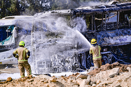 Israeli fire fighters extinguish buses which were directly hit by an Iranian ballistic missile barrage. Israel launched a sweeping assault on the heart of Iran’s nuclear and military structure deploying warplanes and drones previously smuggled into the country to strike key facilities, kill top generals and scientists a barrage it said was necessary before its adversary got any closer to building an atomic weapon. Iran retaliates by unleashing scores of ballistic missiles on Israel where explosions flared in the skies over Jerusalem and Tel Aviv shaking the buildings below.