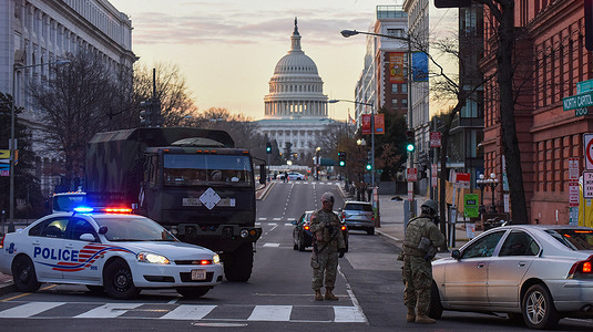 Police and National Guard soldiers stop vehicles at a checkpoint near the U.S. Capitol Building on the day before the inauguration ceremonies for President-elect Joe Biden. As many as 25,000 armed National Guard troops are expected in DC due to threats of violent protests.