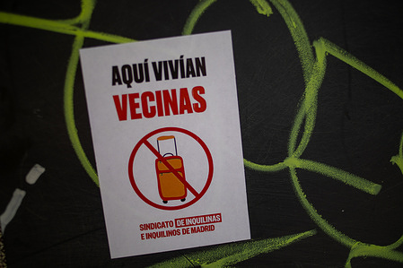 A placard with the message: "A neighbor lived here" is seen during a demonstration in the Lavapiés neighborhood of Madrid. Various social groups demonstrated on the streets of the Lavapiés neighborhood in Madrid to demand an end to real estate speculation, cuts to public healthcare, improved neighborhood security, and an end to drug trafficking, as well as excessive police control against migrants, under the slogan: "Lavapiés at its limit."