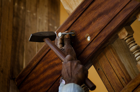 Expert labourer uses traditional methods to build Dhows at the Omani port of Sur
Oman has a long and rich maritime history and the port city of Sur continues the legacy. The Arabian Dhow is a traditional wooden sailing ship that is hand crafted by artisans using century’s old techniques. Made to order the boats are more likely to be employed in the tourism sector than that of the seafaring trade that gave the port its prominence.