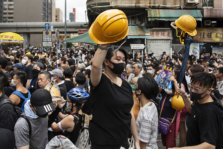 Volunteers give away helmets to the protesters. Despite the Hong Kong government's efforts to calm the situation by declaring the extradition bill is "dead", thousands of protesters still took part in anti-government protests in different areas of Hong Kong. Multiple clashes between protesters and the police have been reported and a large number of protesters have been arrested by the police.