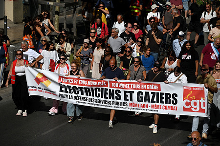 Protesters holding a banner march through the streets of Marseille during the demonstration. Protesters are marching in Marseille in defense of public services.