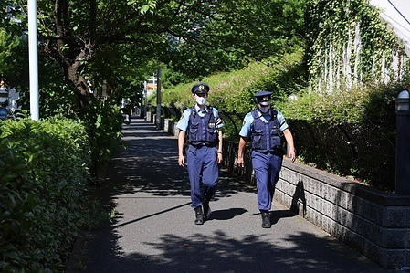 Police officers on patrol duty around the Olympic Village in Harumi.
Usually the heart piece of Olympic Games, the Tokyo 2020 Olympic village in Harumi is secured behind tall metal fences with military and police on patrol duty and check points with roadblocks. Inside, athletes and other members of the Olympic teams have to adhere to strict protocols to minimize the risk of contracting Sars-CoV-2-Coronavirus.