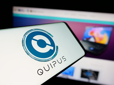 In this photo illustration, a smartphone with the logo of Bolivian tech company Empresa Publica Quipus is seen on screen in front of website.